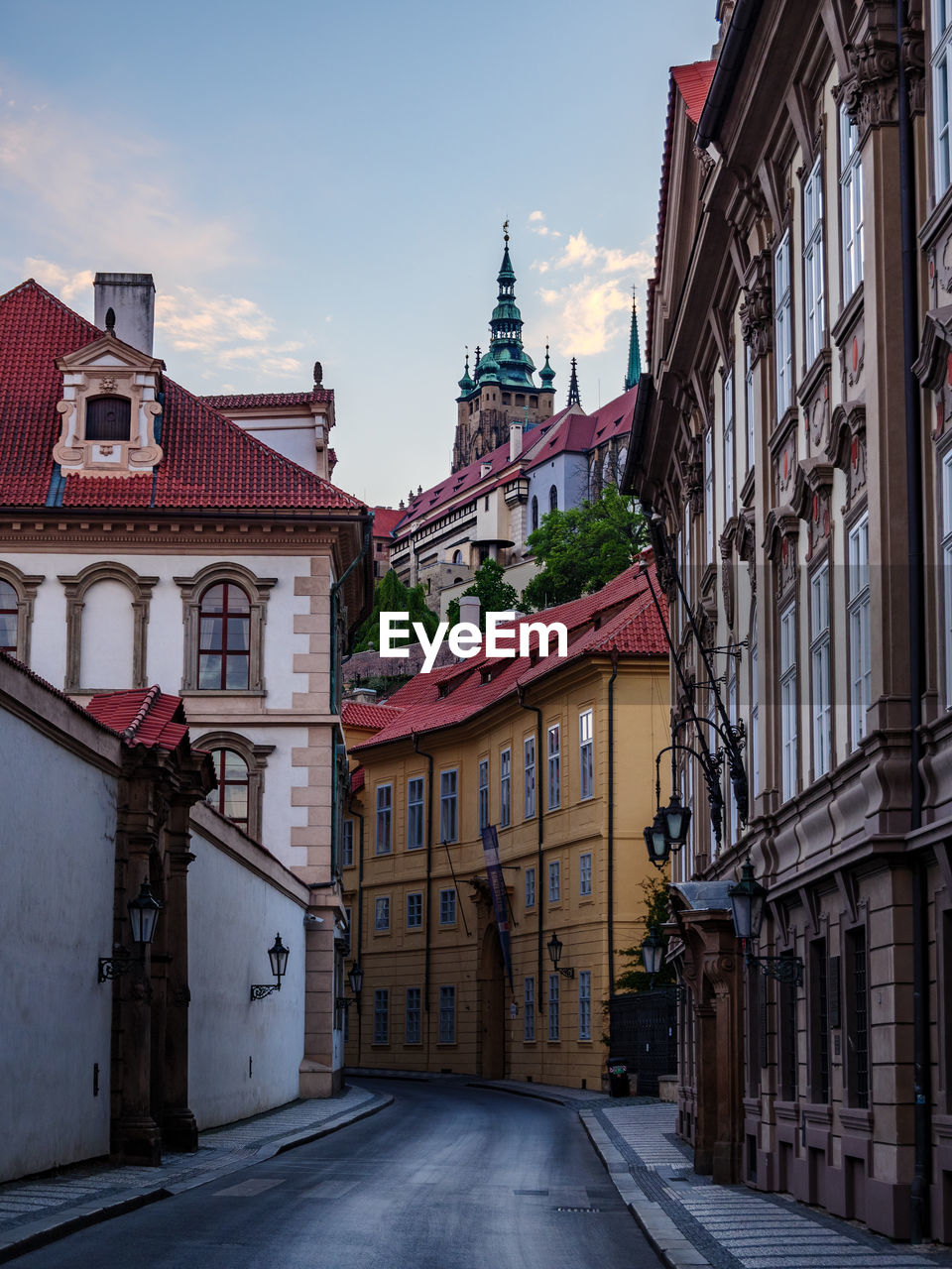 ROAD AMIDST BUILDINGS IN TOWN