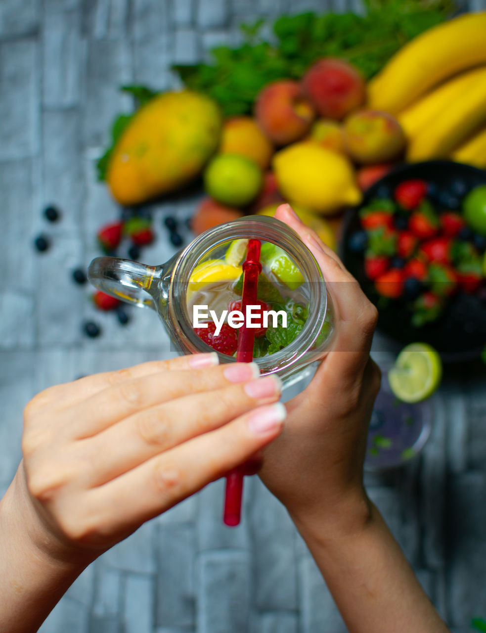 Cropped hand of woman holding drink