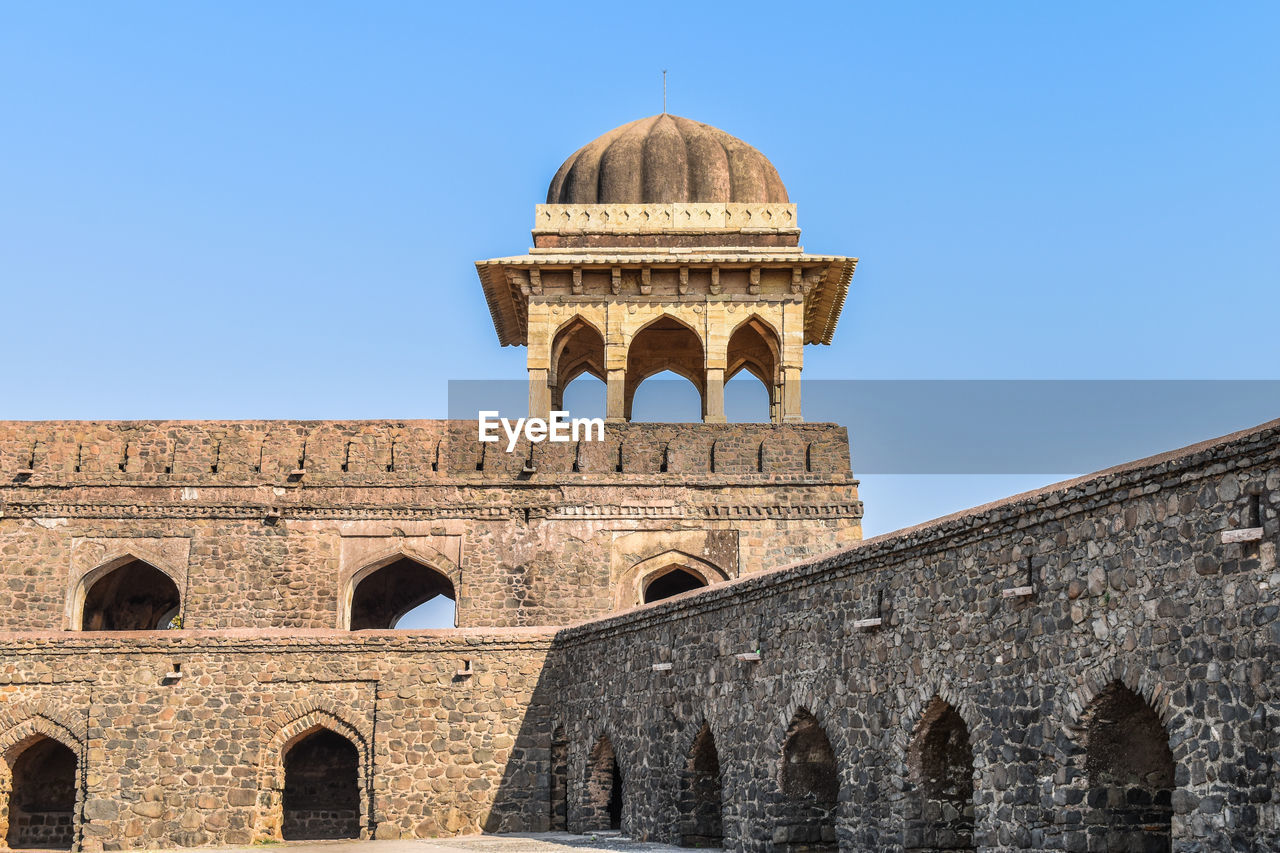 Low angle view of rani roopmati pavilion against clear blue sky