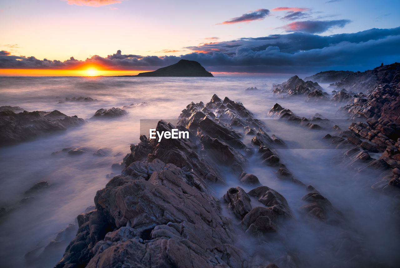 Scenic view of sea against sky during sunset