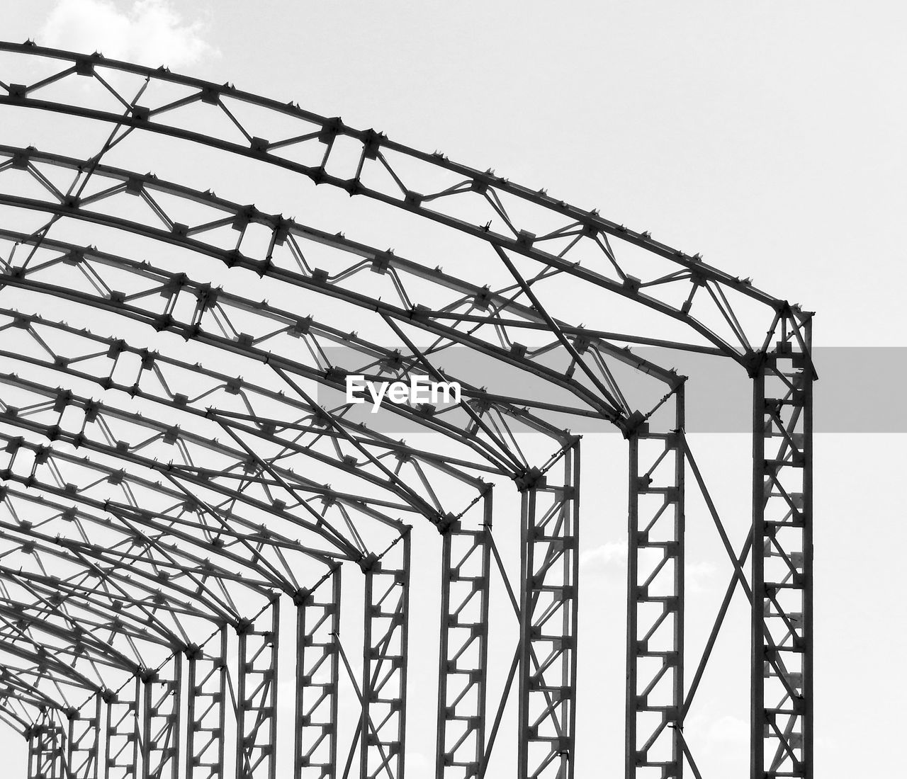 LOW ANGLE VIEW OF METALLIC STRUCTURE AGAINST SKY