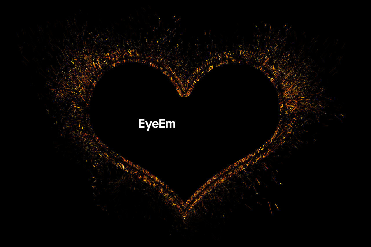CLOSE-UP OF HEART SHAPE MADE FROM BLACK BACKGROUND