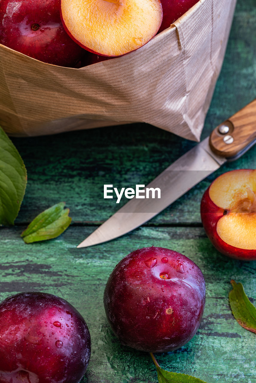 High angle view of plums on table