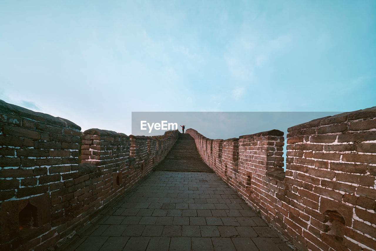 Distant view of man standing on great wall of china