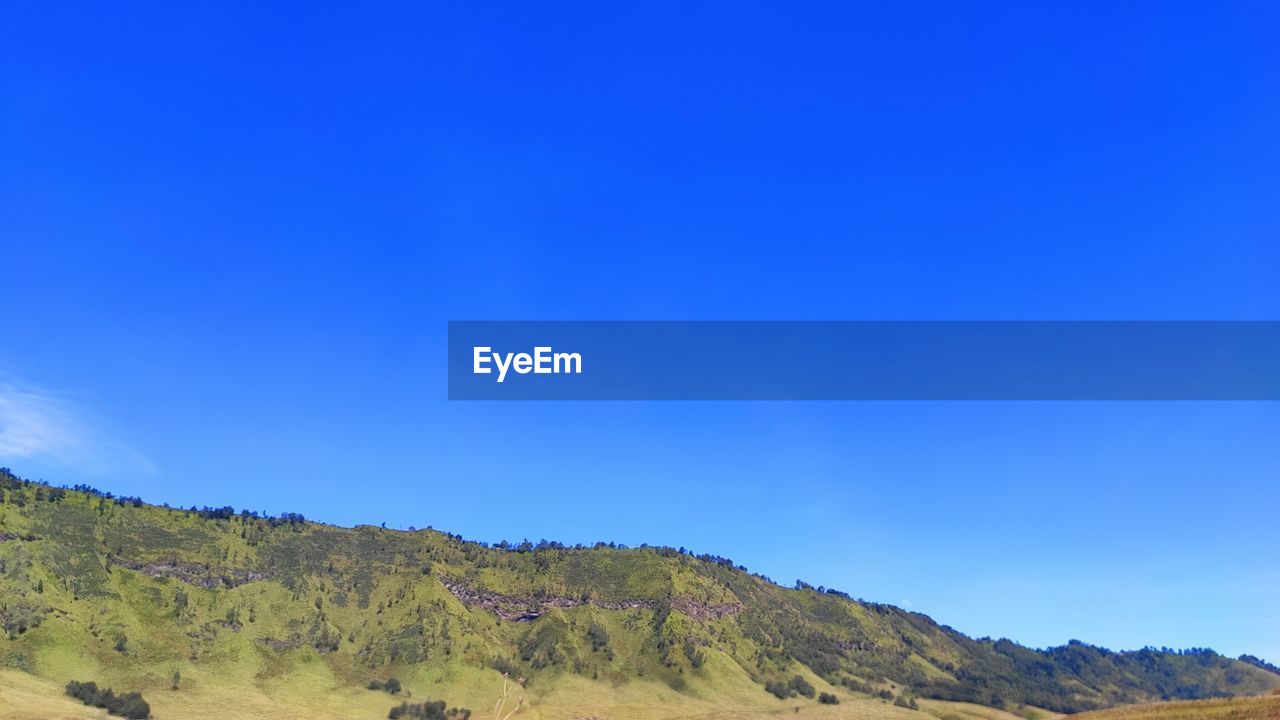 SCENIC VIEW OF MOUNTAIN AGAINST CLEAR BLUE SKY