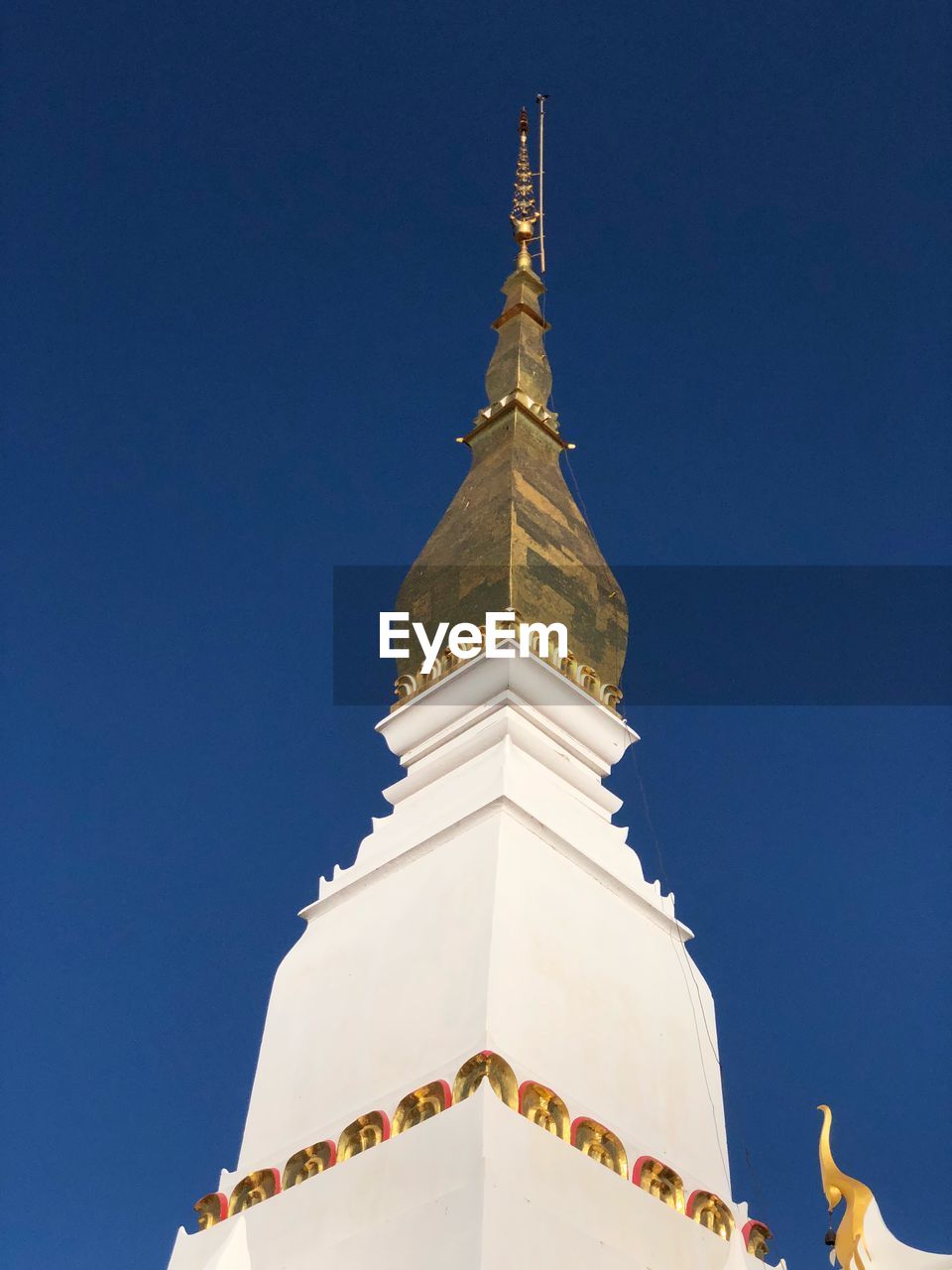 LOW ANGLE VIEW OF CATHEDRAL AGAINST BLUE SKY