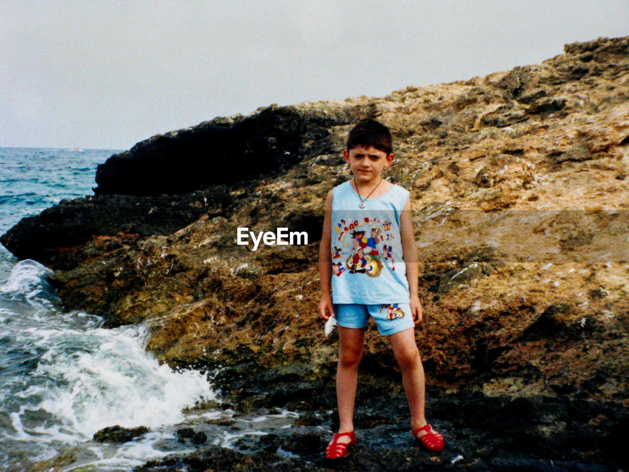 PORTRAIT OF BOY STANDING IN SEA