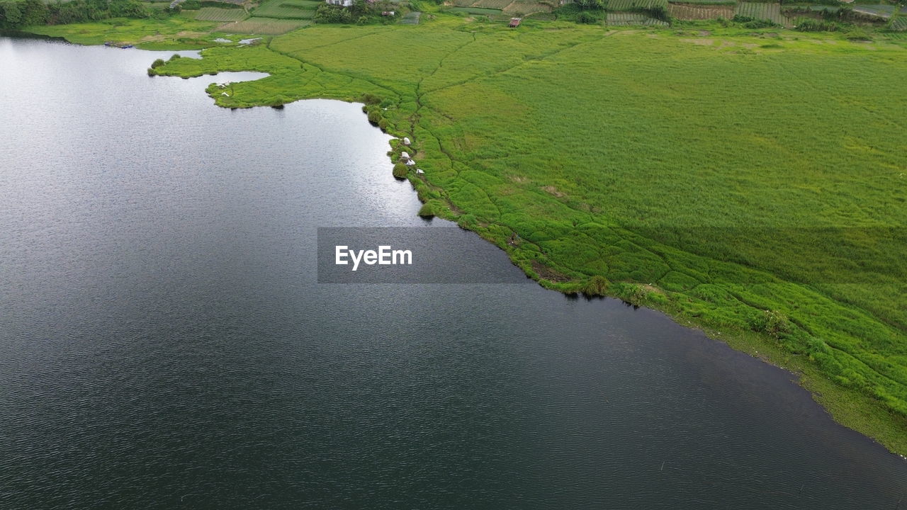 water, green, environment, reservoir, landscape, aerial photography, nature, scenics - nature, land, beauty in nature, no people, tranquility, reflection, plant, river, coast, aerial view, waterway, day, rural scene, tranquil scene, agriculture, high angle view, outdoors, field, grass, travel, non-urban scene, shore, beach, travel destinations, body of water, channel, tourism, bay