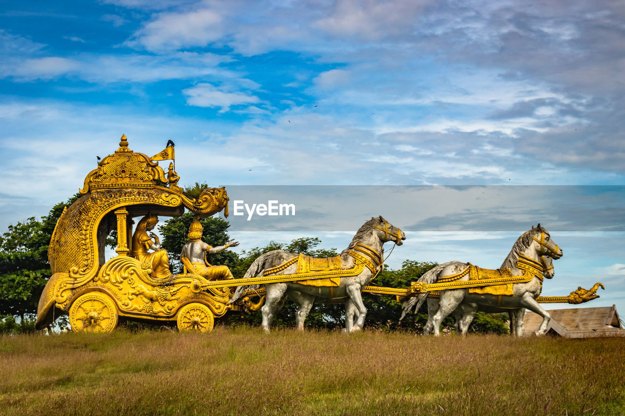 Holly arjuna chariot of mahabharata in golden color with amazing sky background