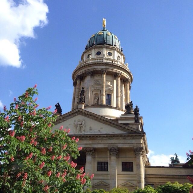 LOW ANGLE VIEW OF BUILT STRUCTURES AGAINST BLUE SKY