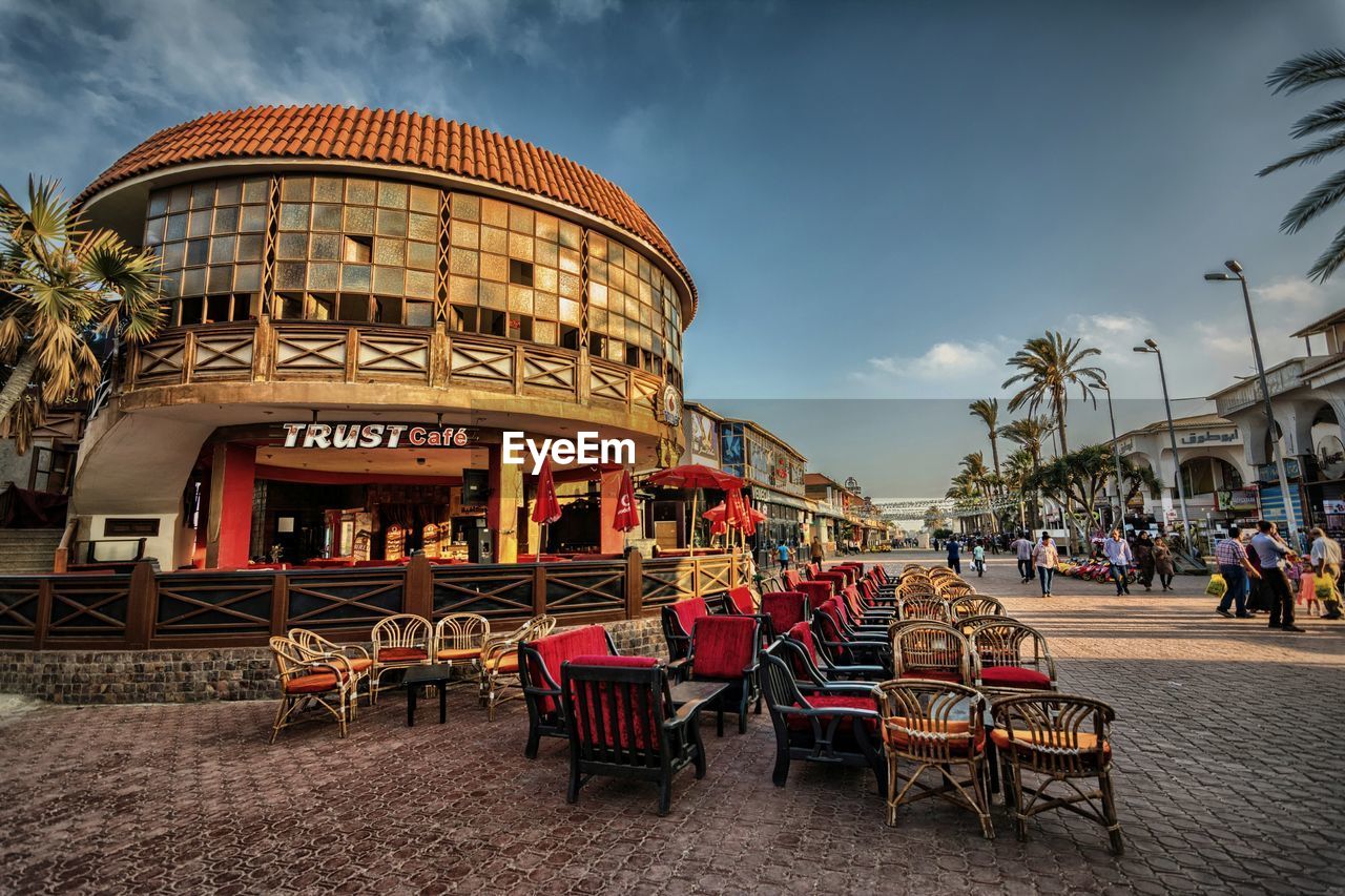 VIEW OF CHAIRS AND TABLES IN STREET