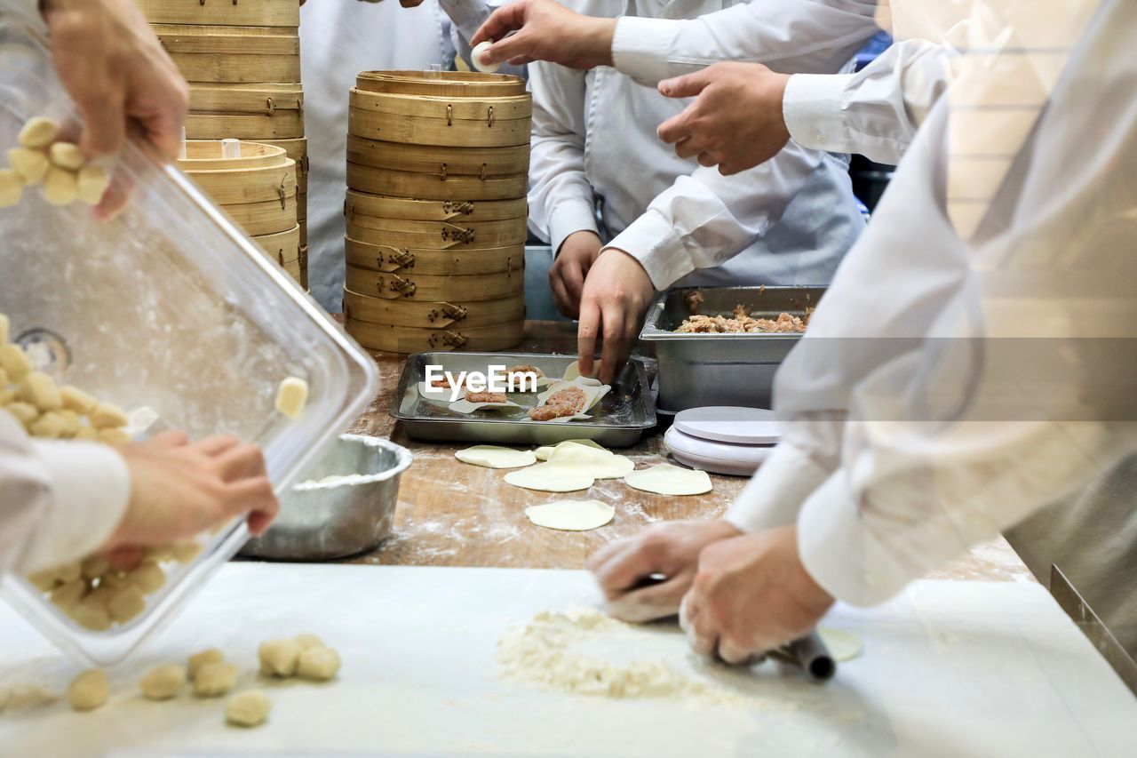 Midsection of man preparing food