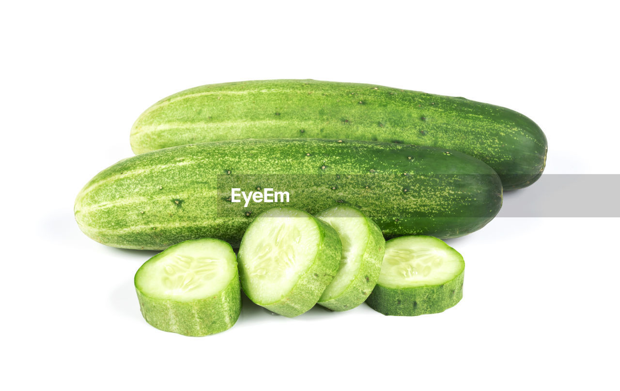 food and drink, food, healthy eating, cucumber, cut out, wellbeing, freshness, green, vegetable, studio shot, produce, white background, zucchini, plant, fruit, indoors, gourd, no people, summer squash, raw food, still life, organic, slice, close-up, group of objects