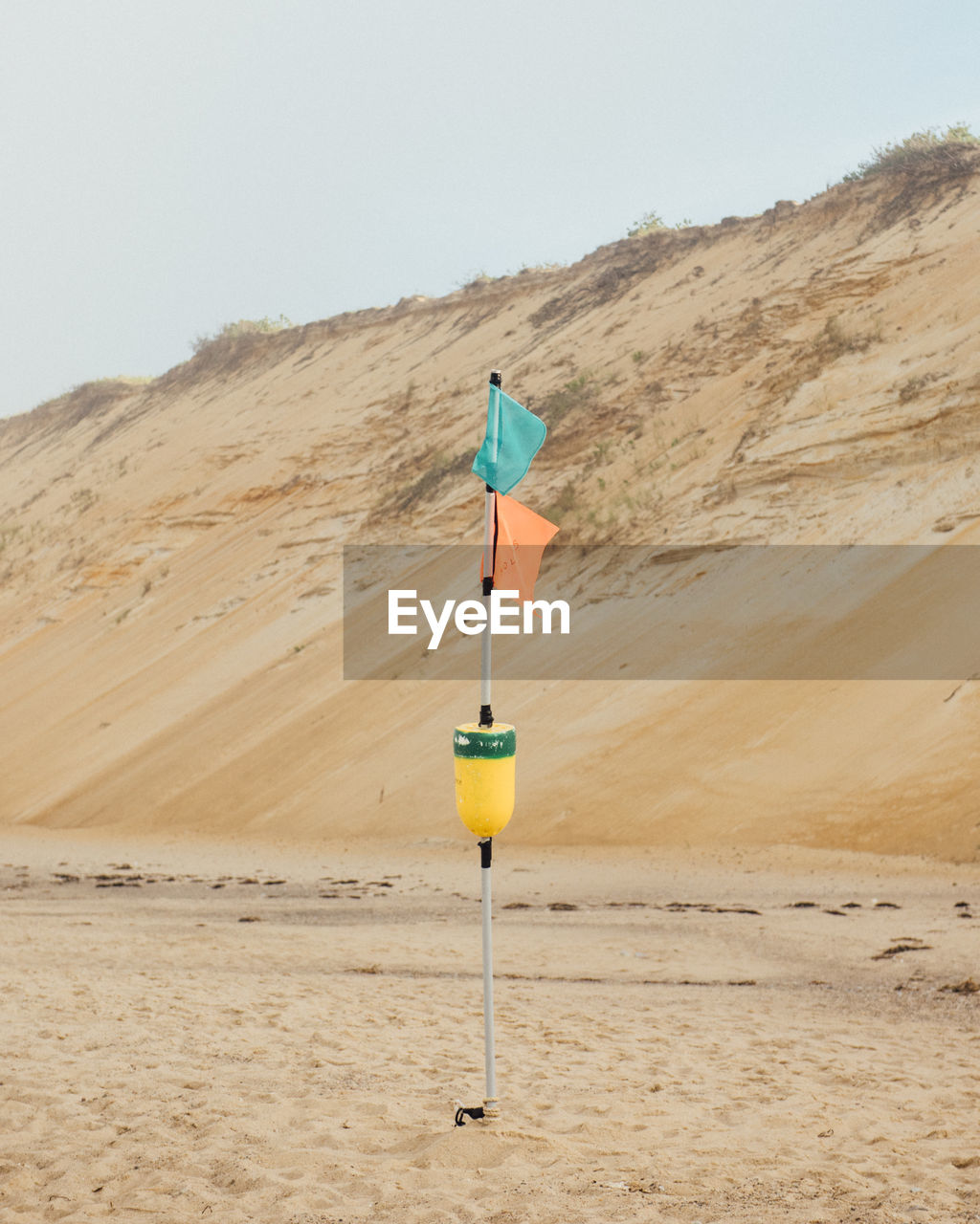 Colorful flags wave in the coastal breeze