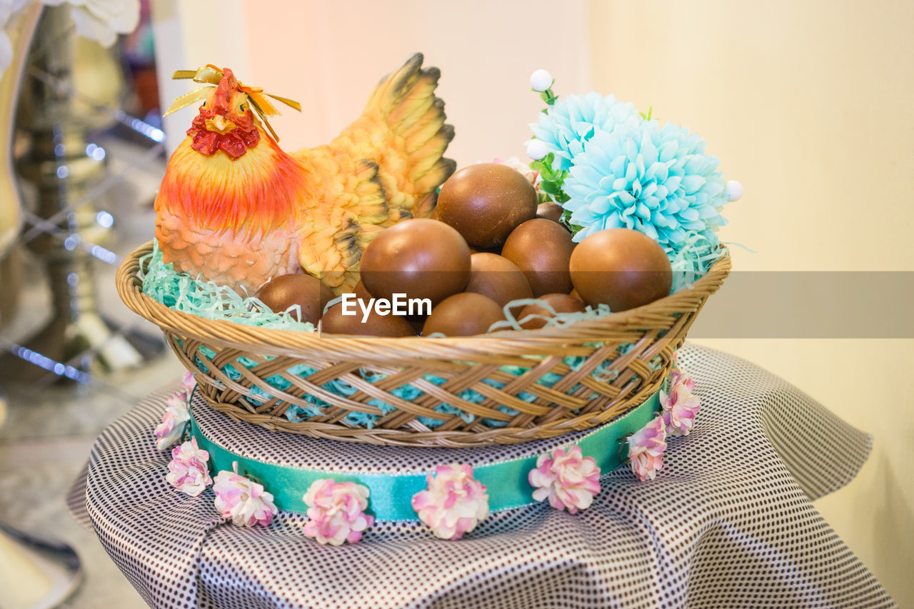 Close-up of eggs and decor in basket