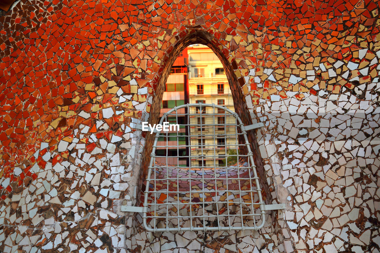 LOW ANGLE VIEW OF BUILDING SEEN THROUGH WINDOW