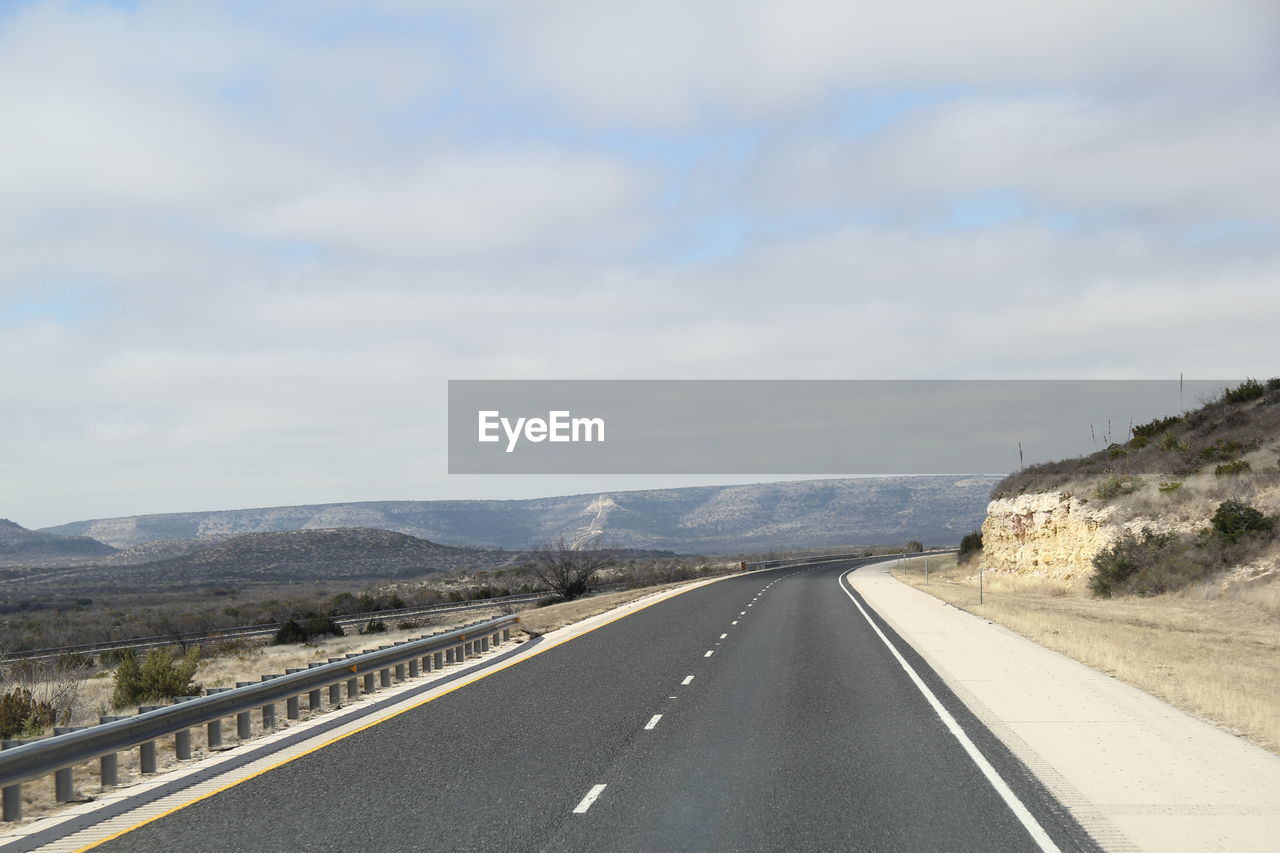 Surface level of empty road along landscape