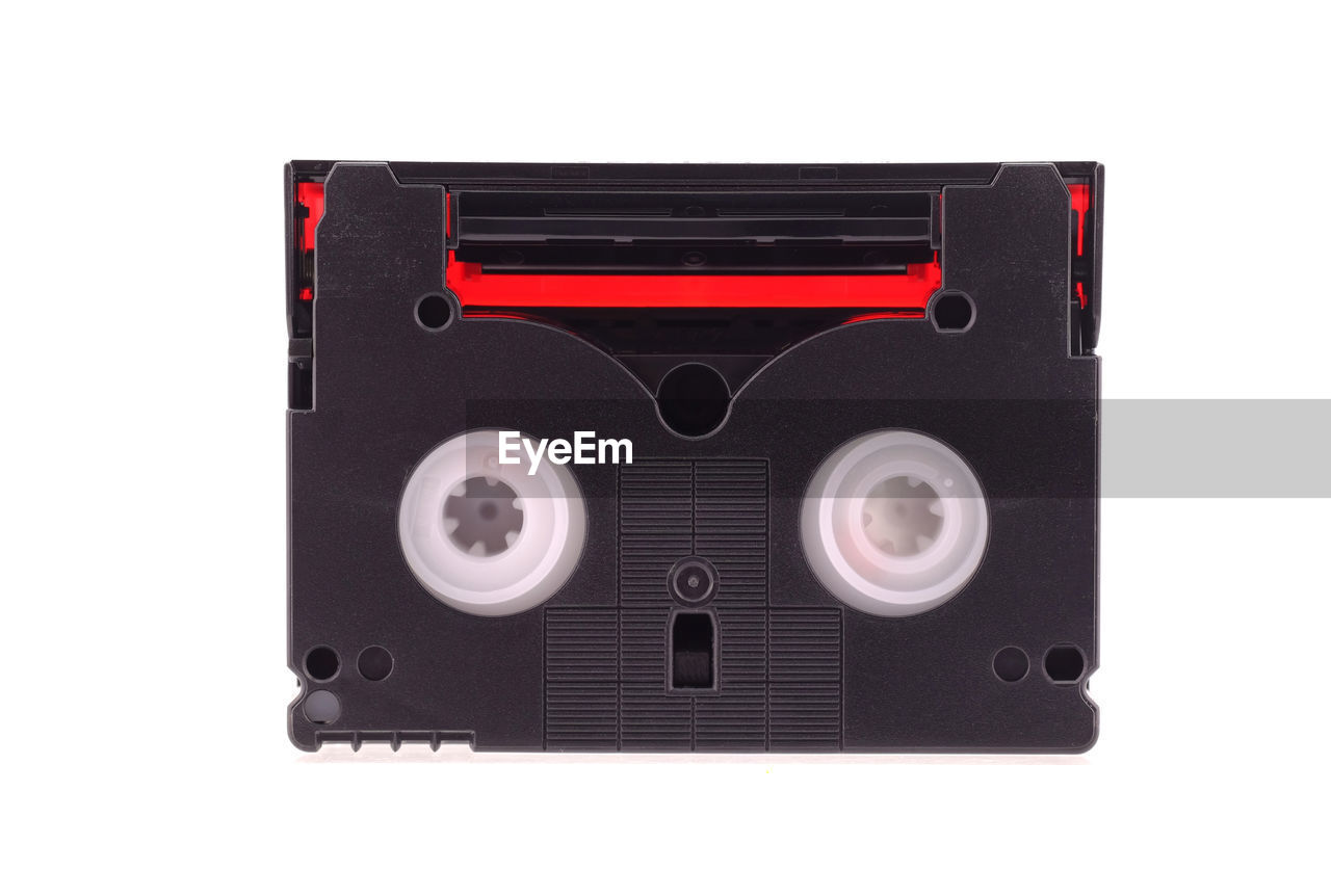 Close-up of audio cassette against white background