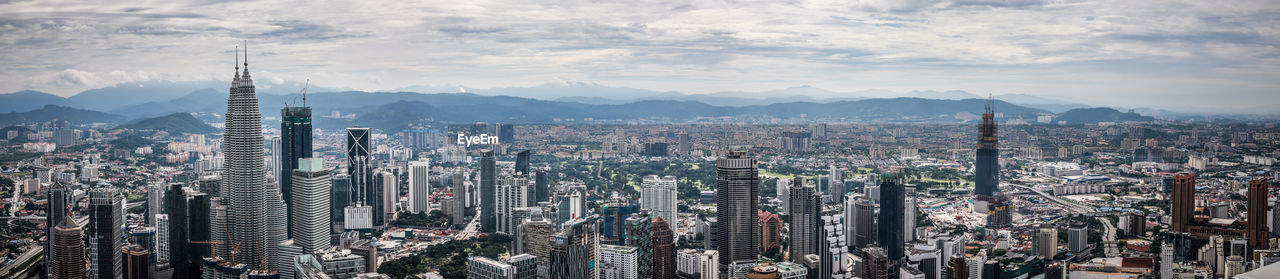 Panoramic view of cityscape against sky