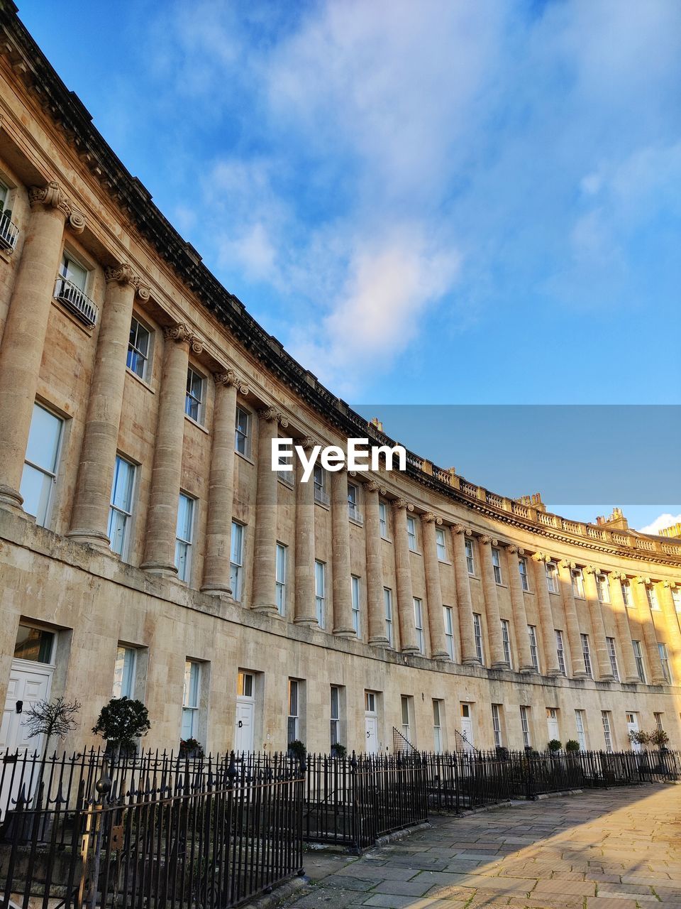 Low angle view of building against cloudy sky