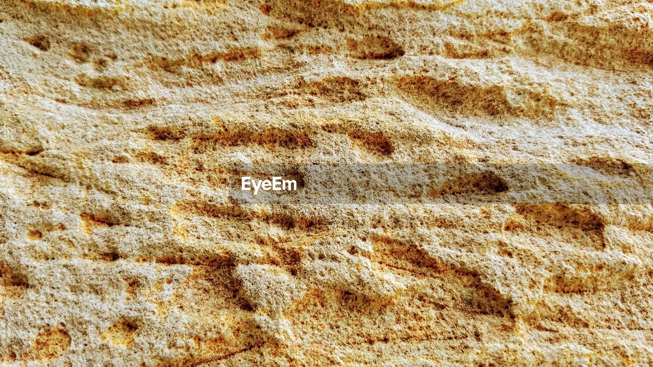 CLOSE UP OF SAND