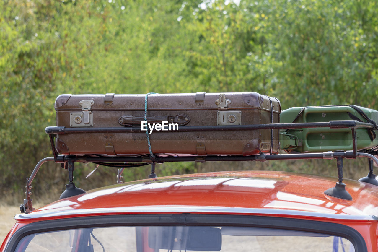 CLOSE-UP OF OLD CAR ON FIELD