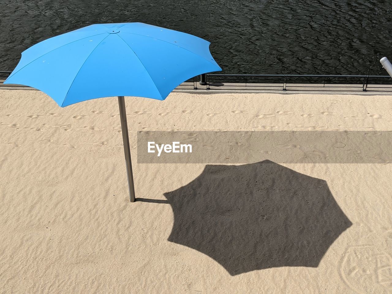 High angle view of umbrella on beach