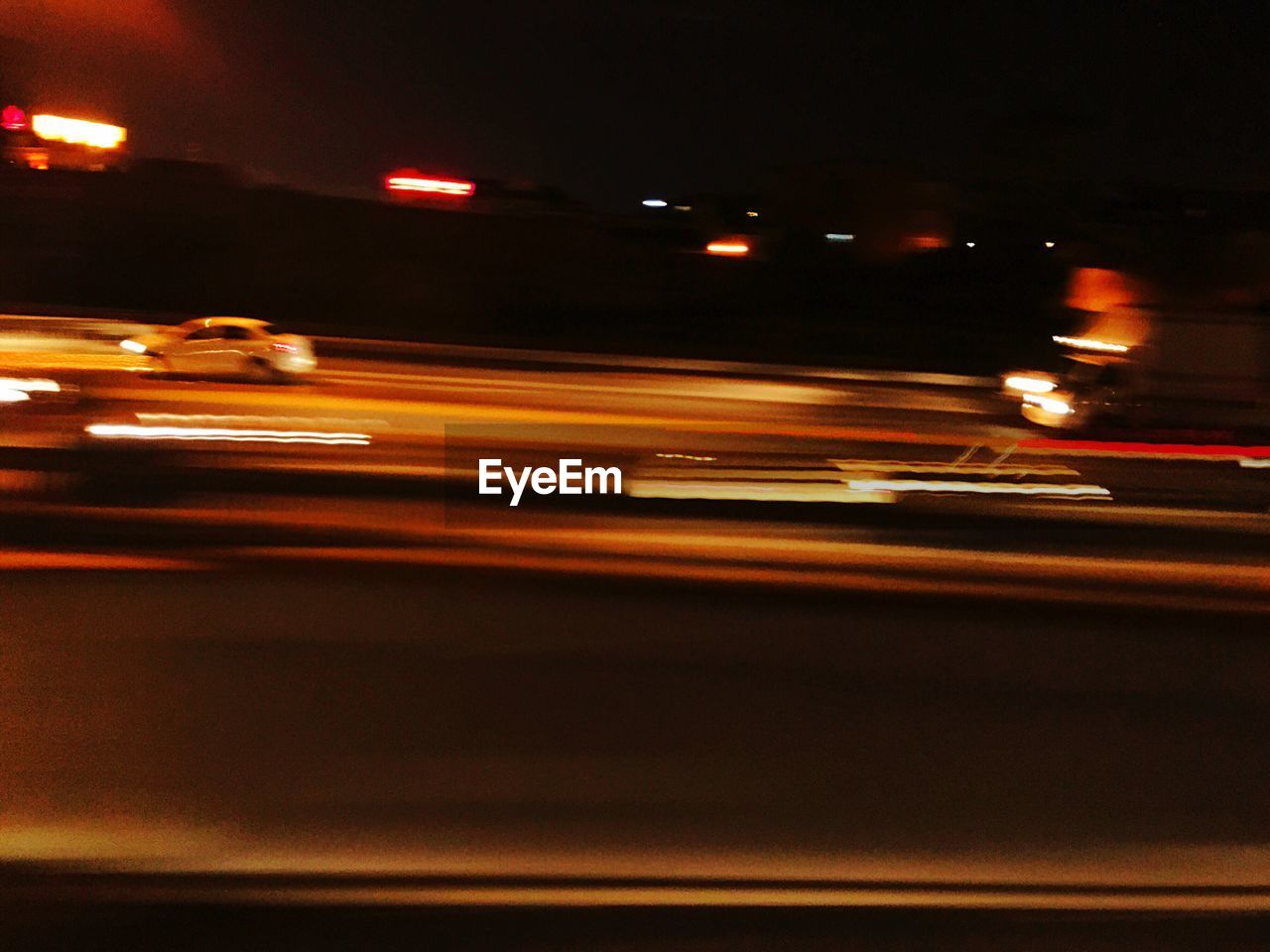 BLURRED MOTION OF CARS ON ROAD