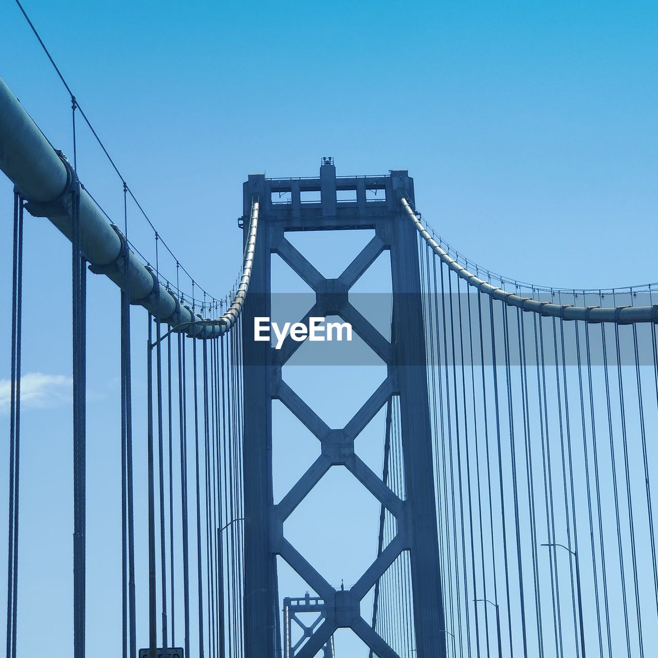 LOW ANGLE VIEW OF SUSPENSION BRIDGE AGAINST SKY