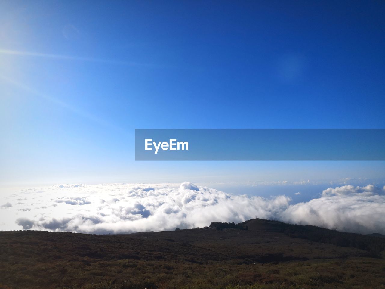 Scenic view of clouds against sky from a mountain top