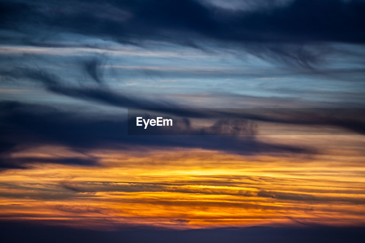 Low angle view of dramatic sky during sunset