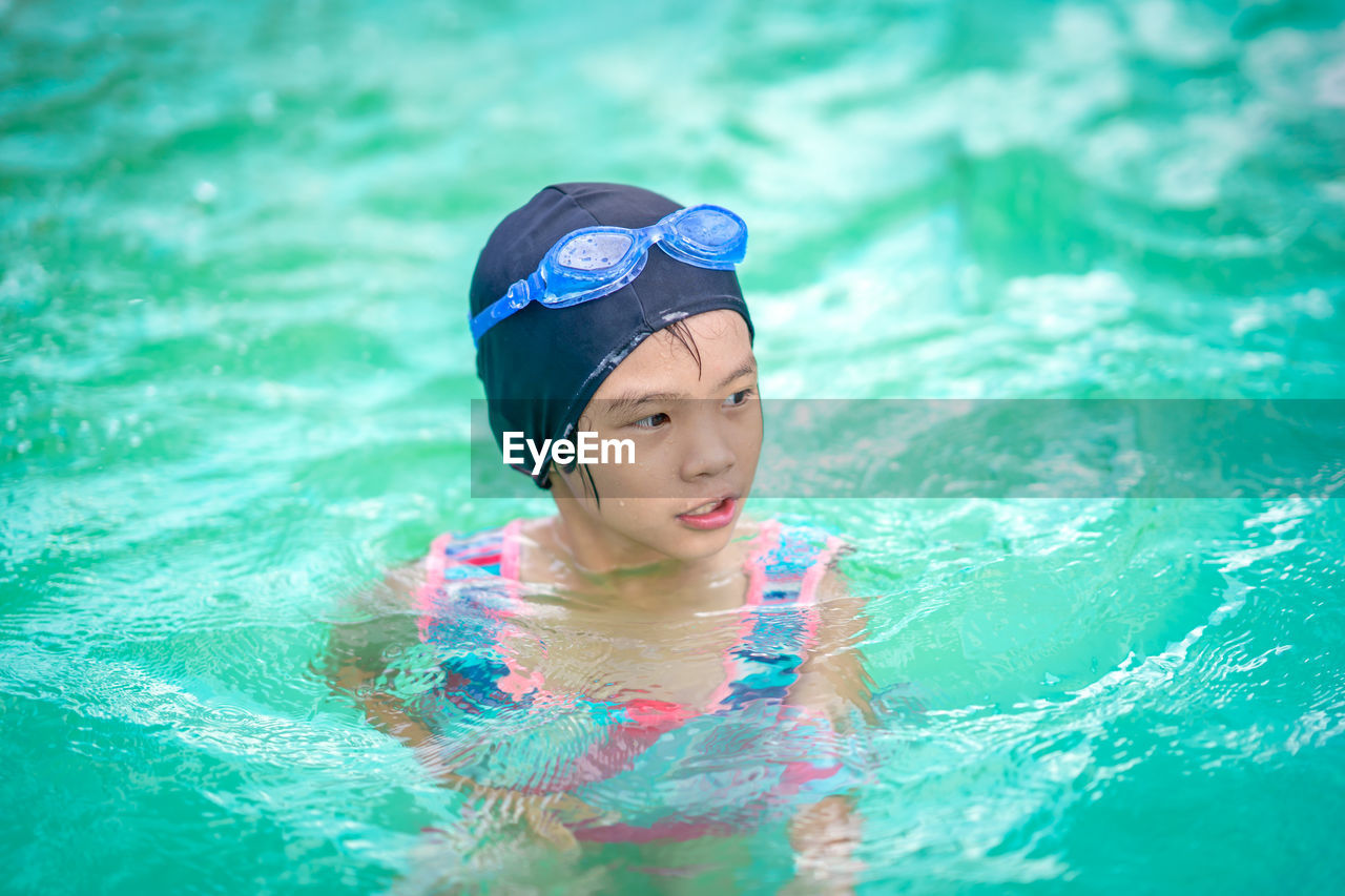 High angle view of girl in swimming pool