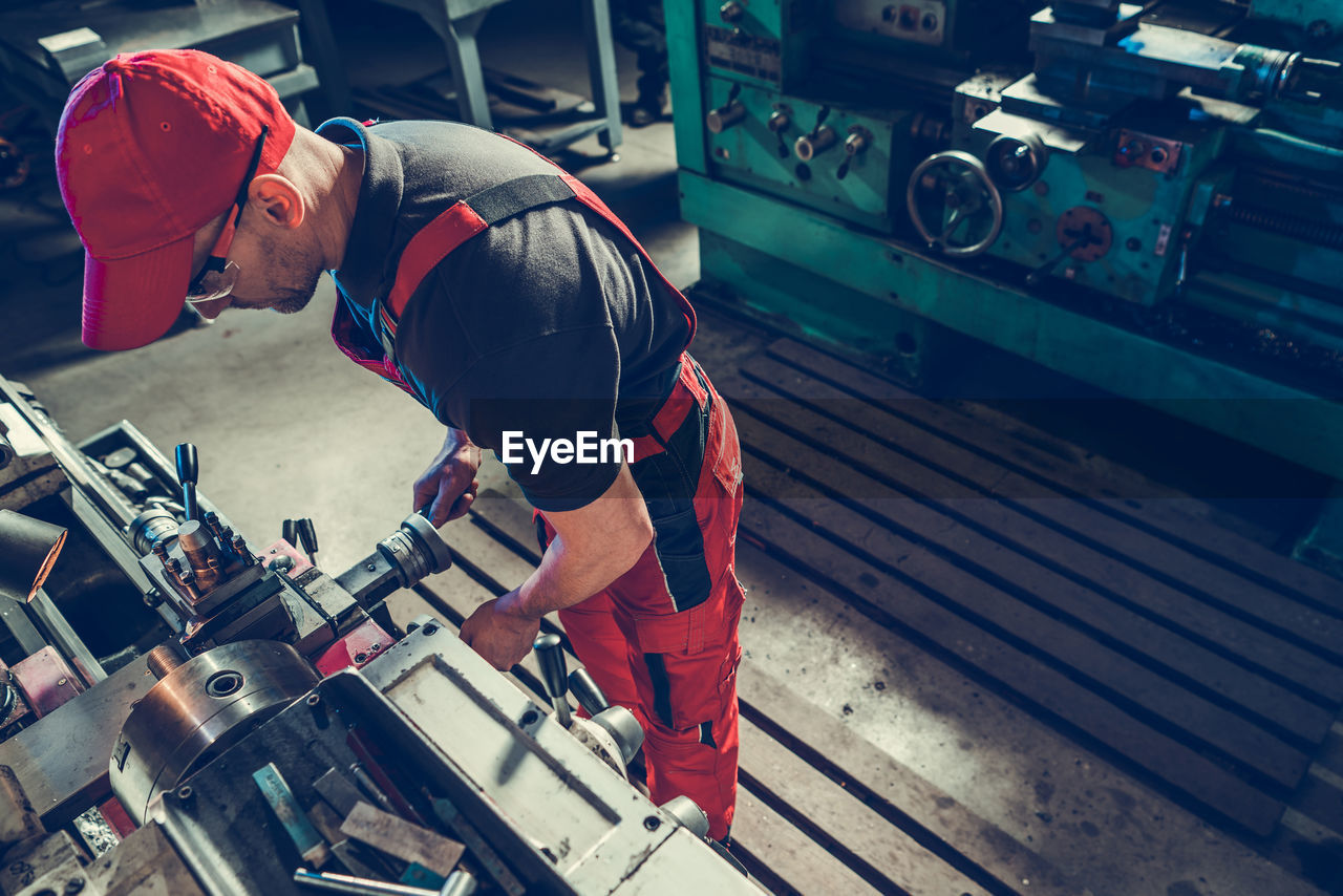 high angle view of man working at factory