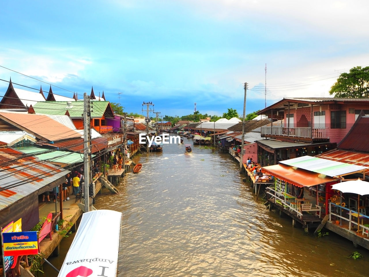 View of townscape against cloudy sky