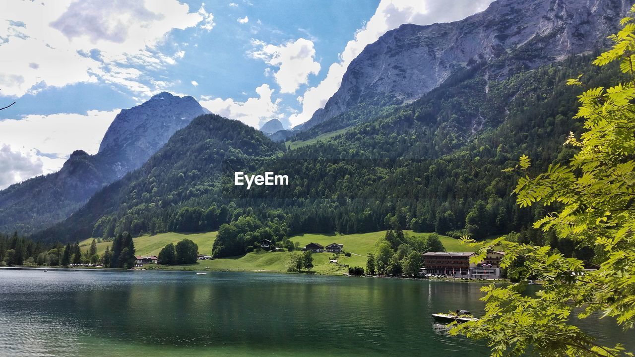 Scenic view of lake and mountains against sky