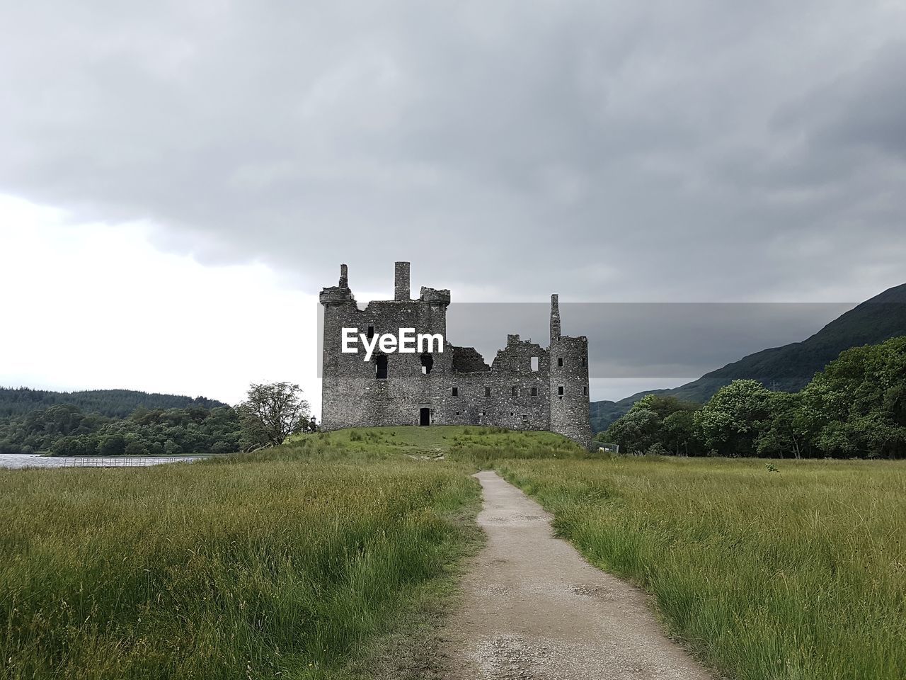 View of historical building in field