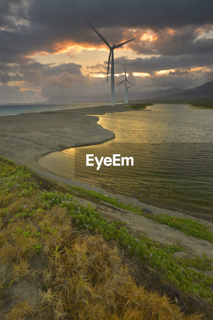 SCENIC VIEW OF BEACH DURING SUNSET