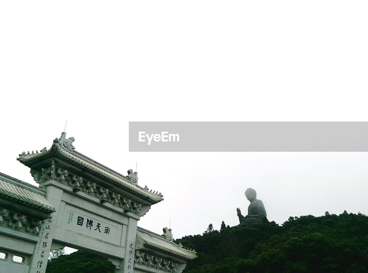 LOW ANGLE VIEW OF BUILT STRUCTURES AGAINST CLEAR SKY