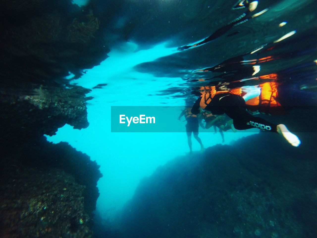 MAN SWIMMING UNDERWATER