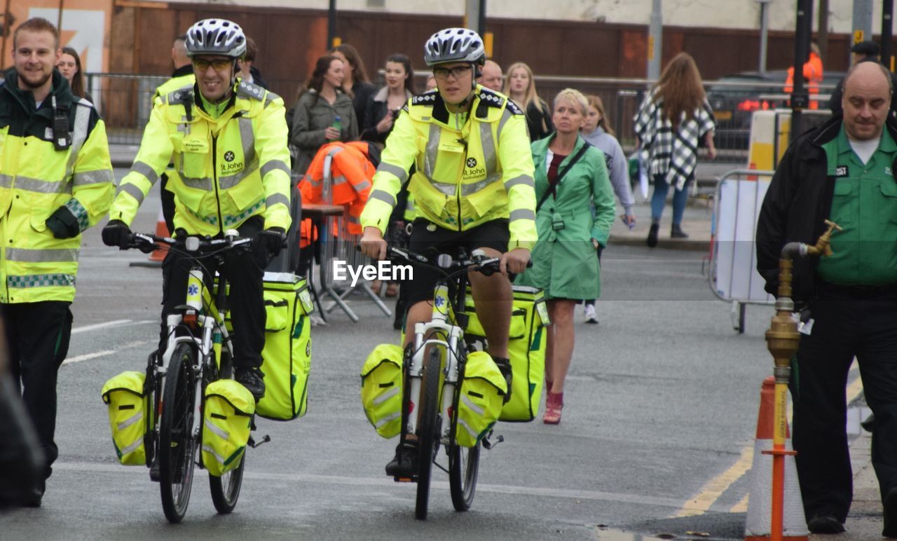 GROUP OF PEOPLE ON ROAD