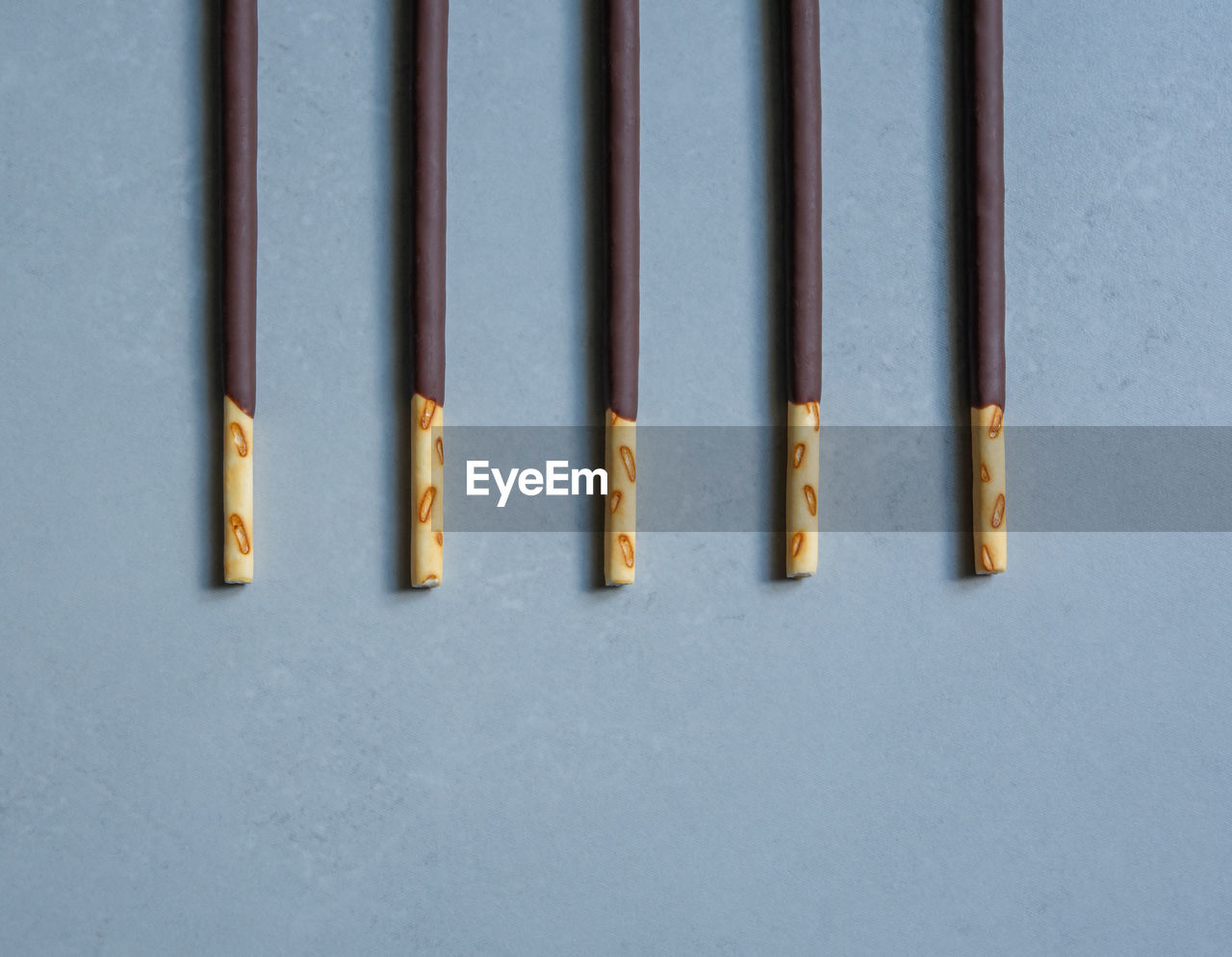 HIGH ANGLE VIEW OF METALLIC OBJECTS ON WALL