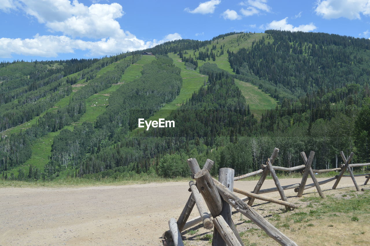 Idyllic shot of green mountain against sky