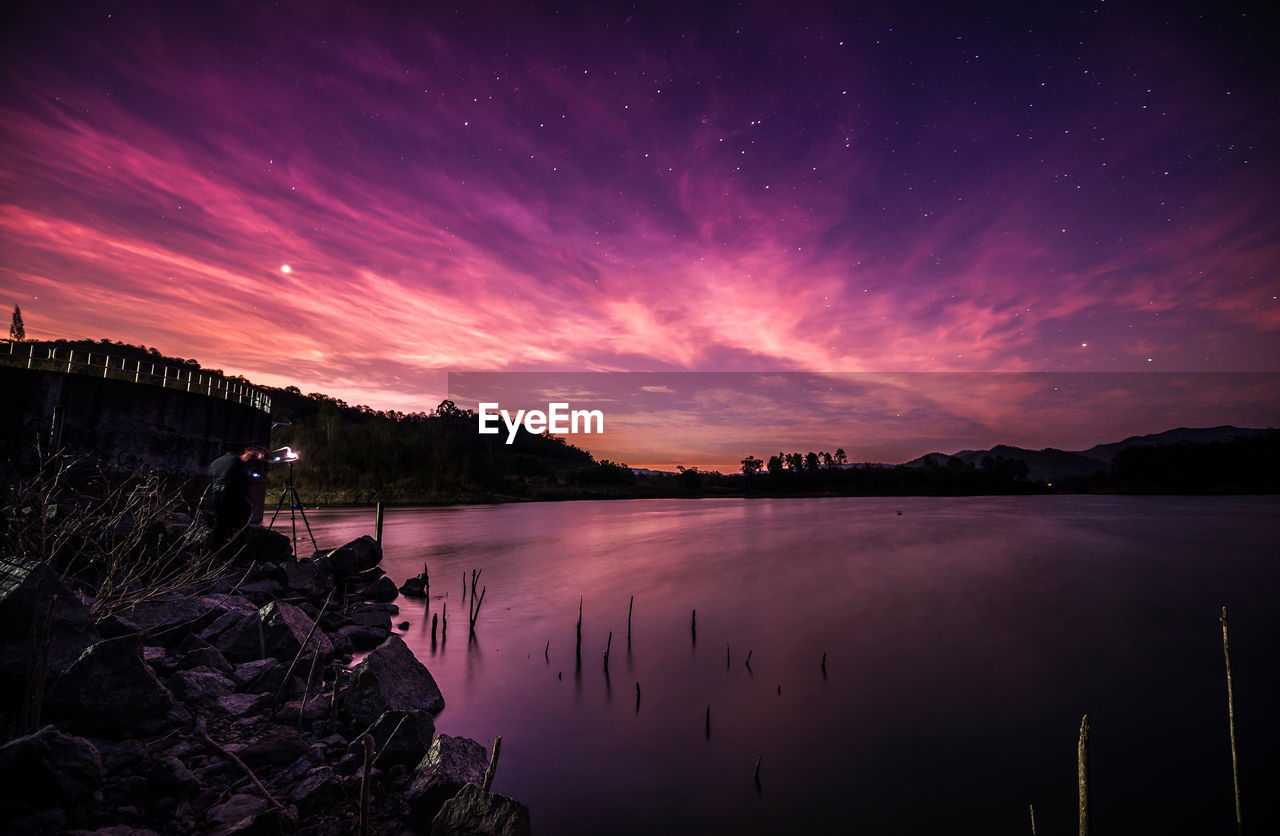 SCENIC VIEW OF LAKE AT NIGHT