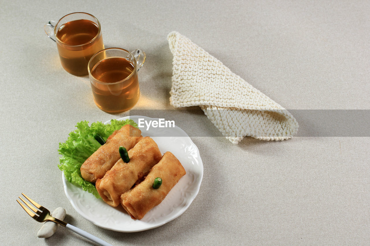 Sosis solo, minced chicken with egg crepe wrap and shape like sausage. 
