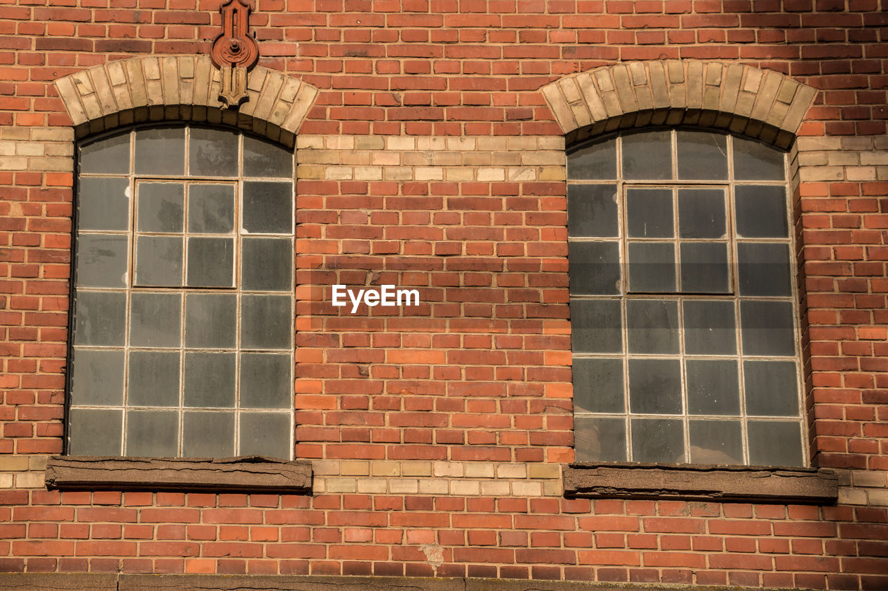 LOW ANGLE VIEW OF BRICK BUILDING