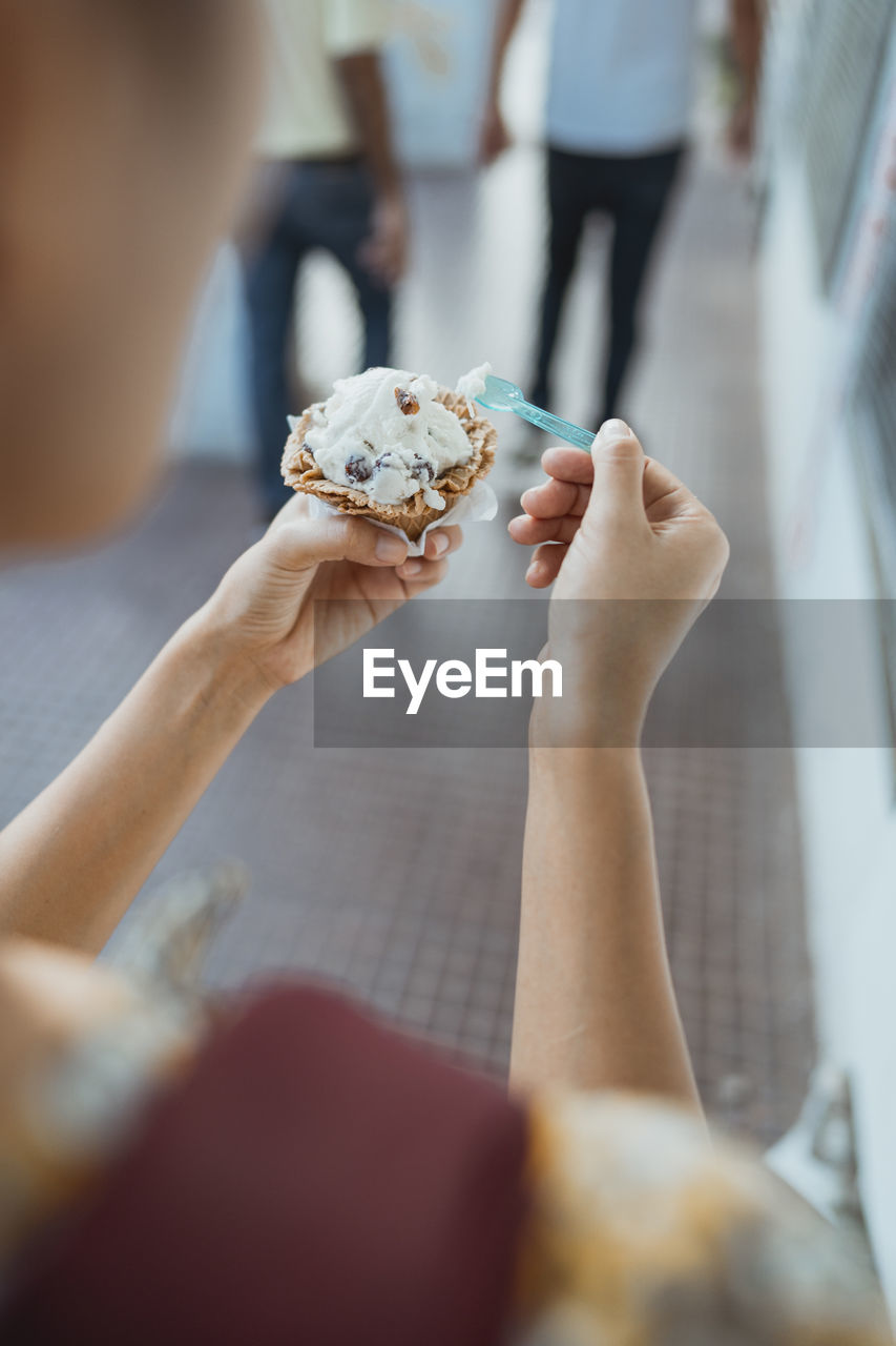 Close-up of woman holding ice cream