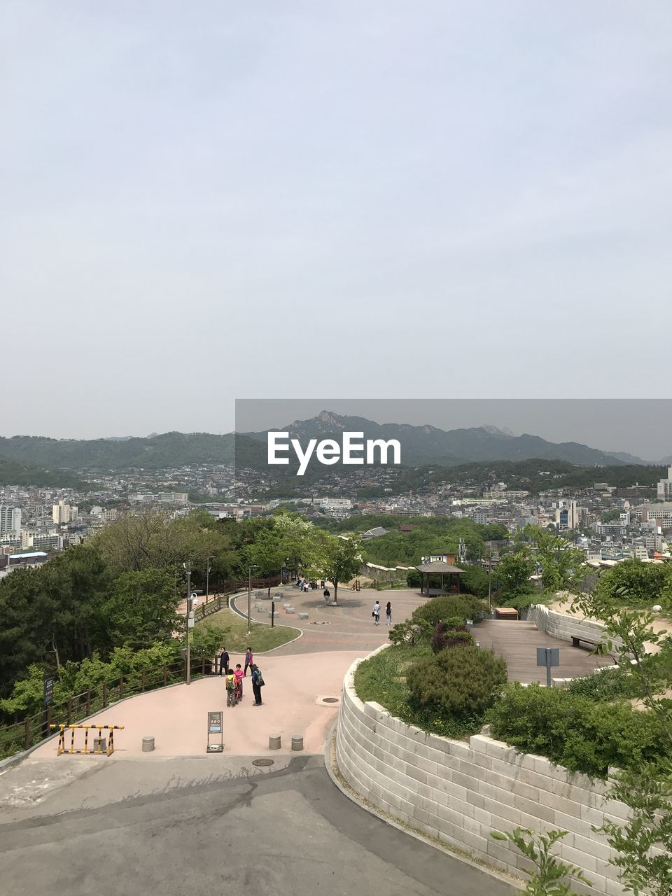 High angle view of city by sea against sky