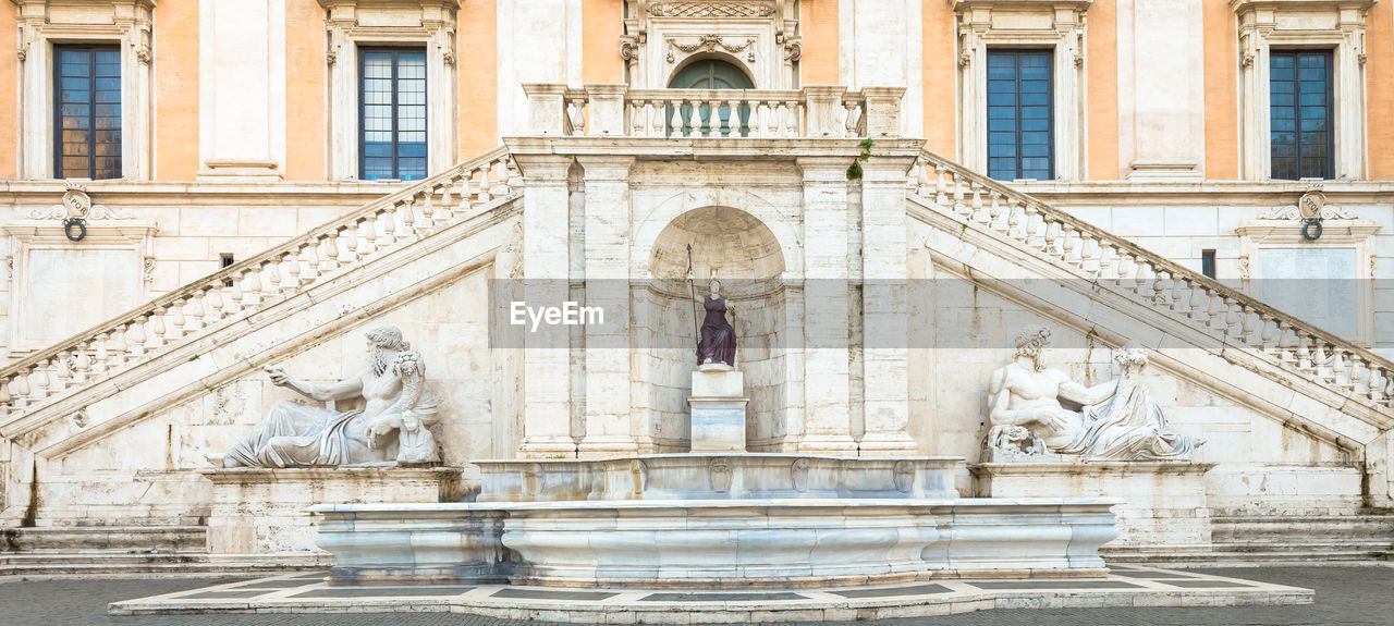 STATUE IN FRONT OF BUILDING