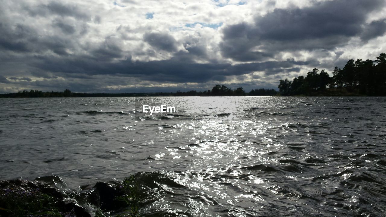 VIEW OF SEA AGAINST CLOUDY SKY