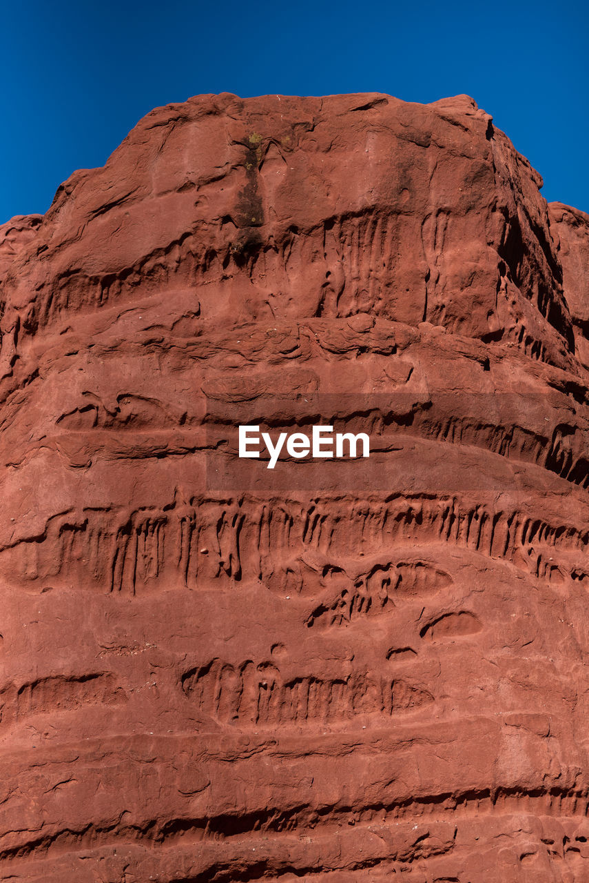 rock, geology, desert, rock formation, nature, travel destinations, scenics - nature, wadi, landscape, valley, land, non-urban scene, environment, arch, plateau, no people, natural environment, mountain, travel, sky, formation, climate, soil, terrain, beauty in nature, sandstone, arid climate, outdoors, clear sky, tourism, physical geography, sunlight, day, extreme terrain, eroded, canyon, ancient, history, cliff